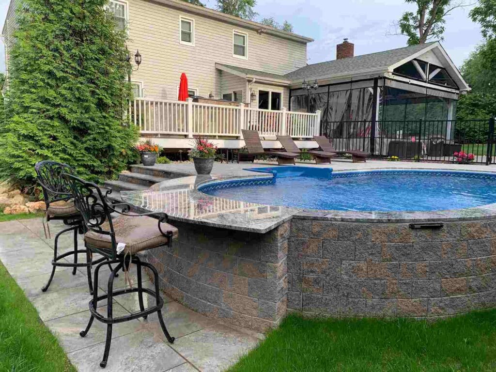 The interesting addition of a drinking section makes the semi-inground pool even more blissful